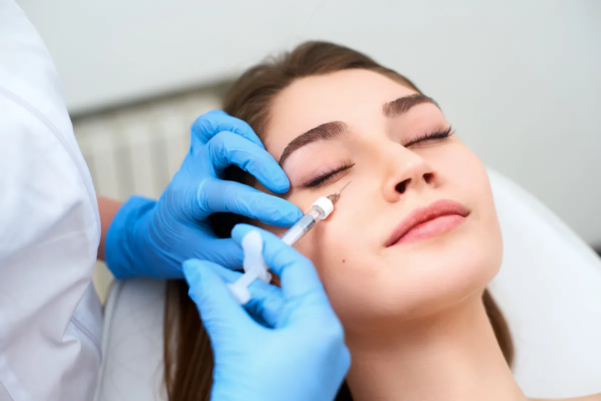 Woman receiving PRF EZ Gel under-eye treatment at Belle Piel Aesthetics