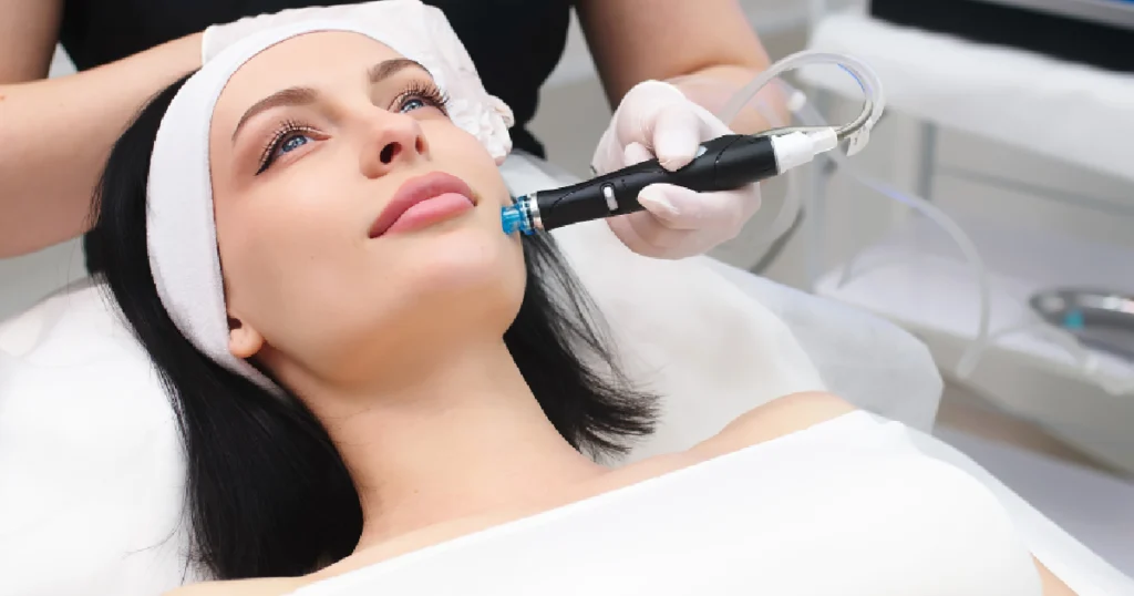 Current image: Women receiving hydrafacial treatment in farming ville, ny
